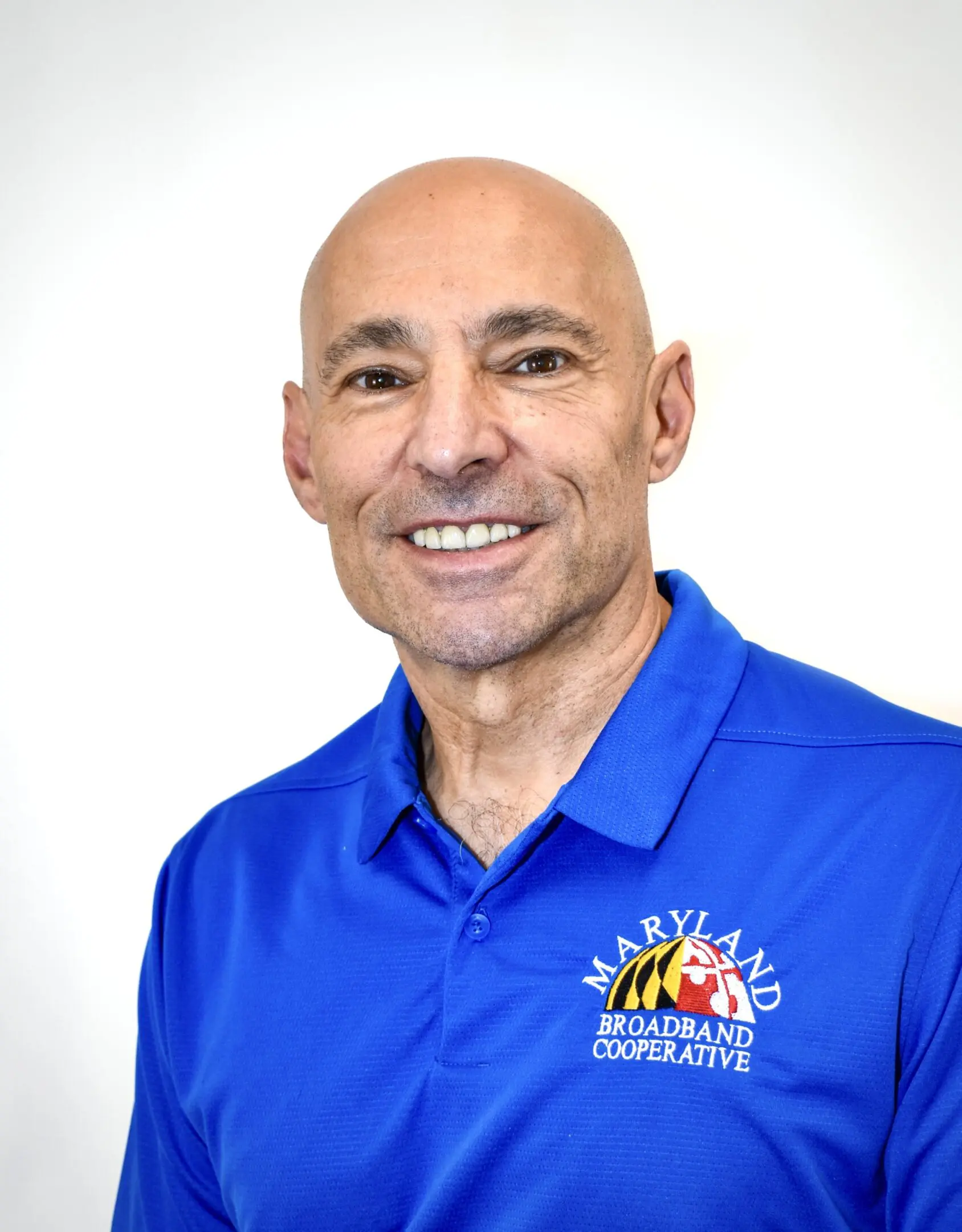 Smiling man in Maryland Broadband Cooperative polo shirt.